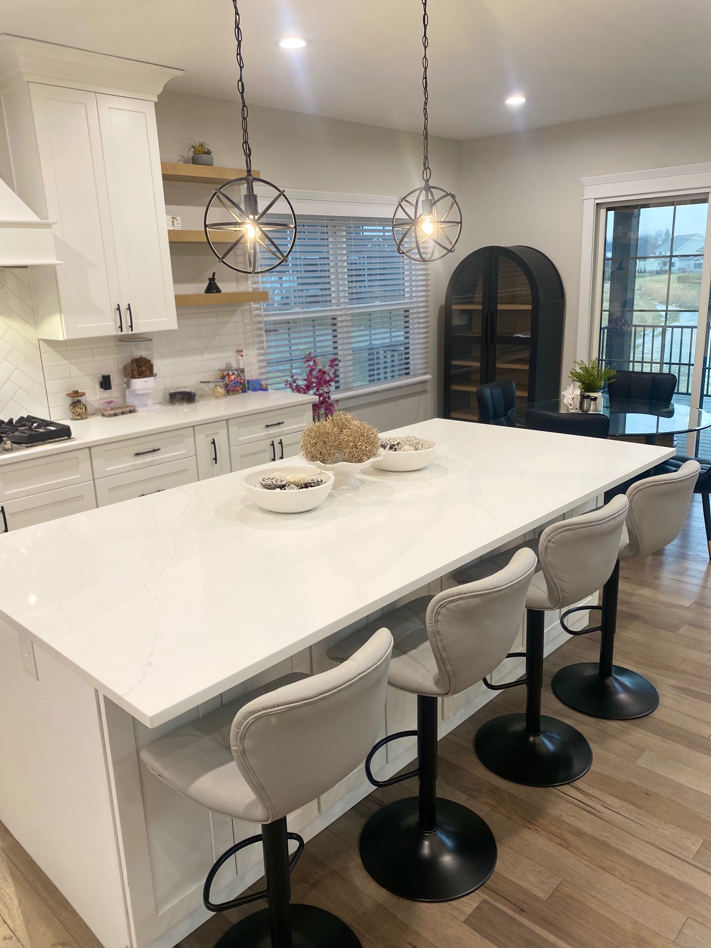 Bright modern kitchen with spotless quartz island after RealsMaster cleaning